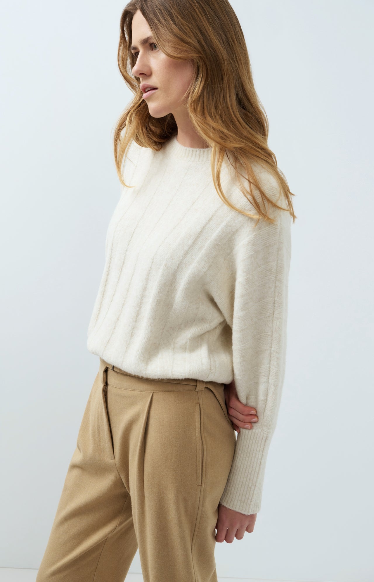 Sweater with batwing sleeves and drawcord at the hem