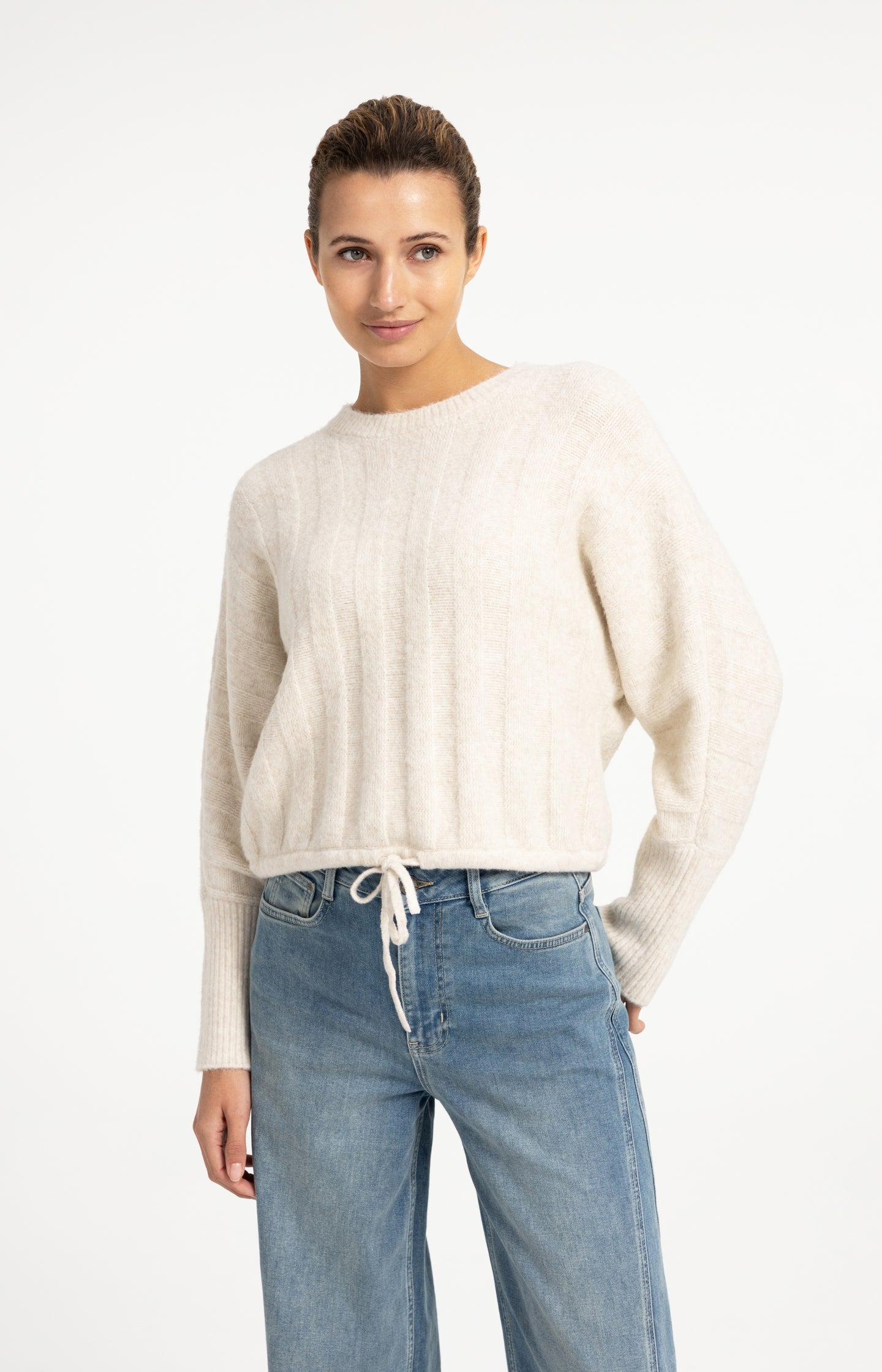 Sweater with batwing sleeves and drawcord at the hem