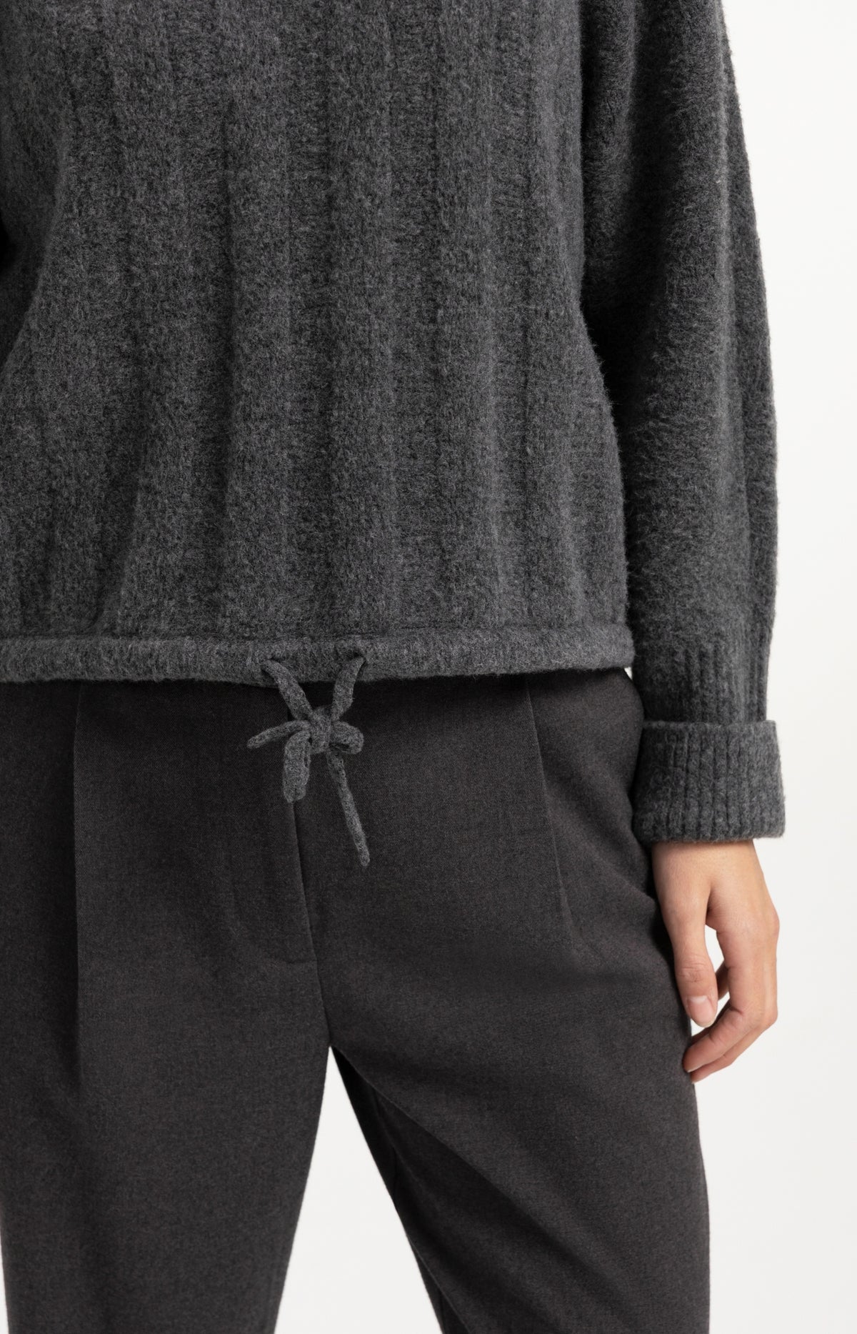 Sweater with batwing sleeves and drawcord at the hem