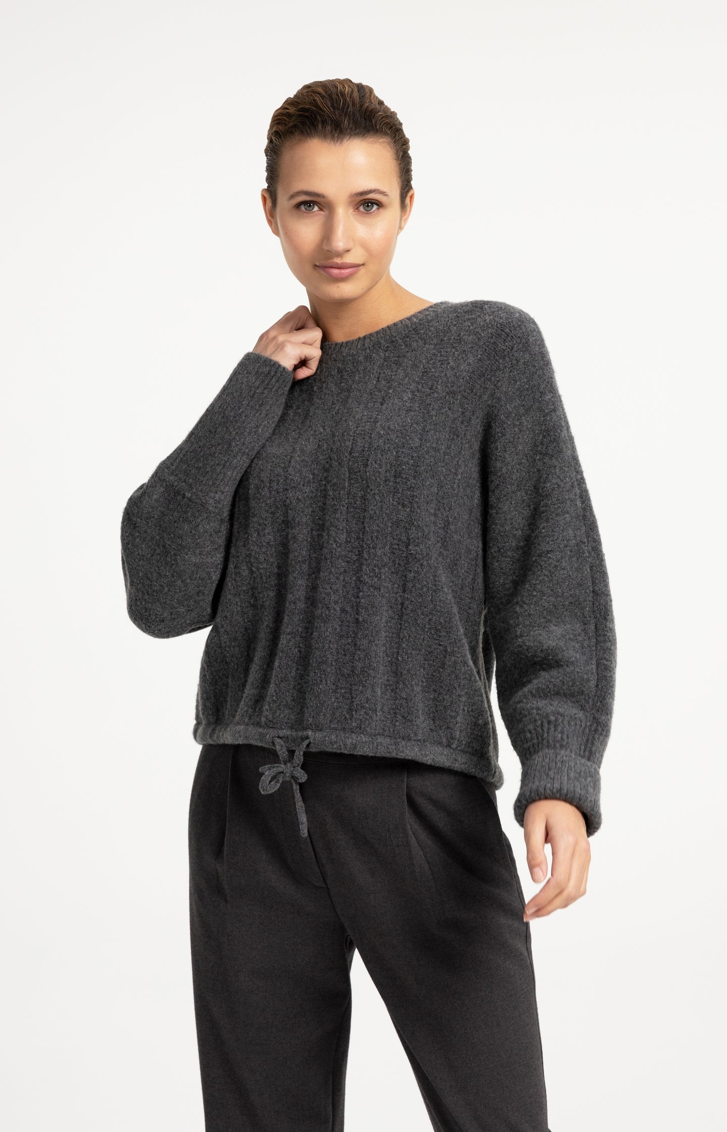 Sweater with batwing sleeves and drawcord at the hem
