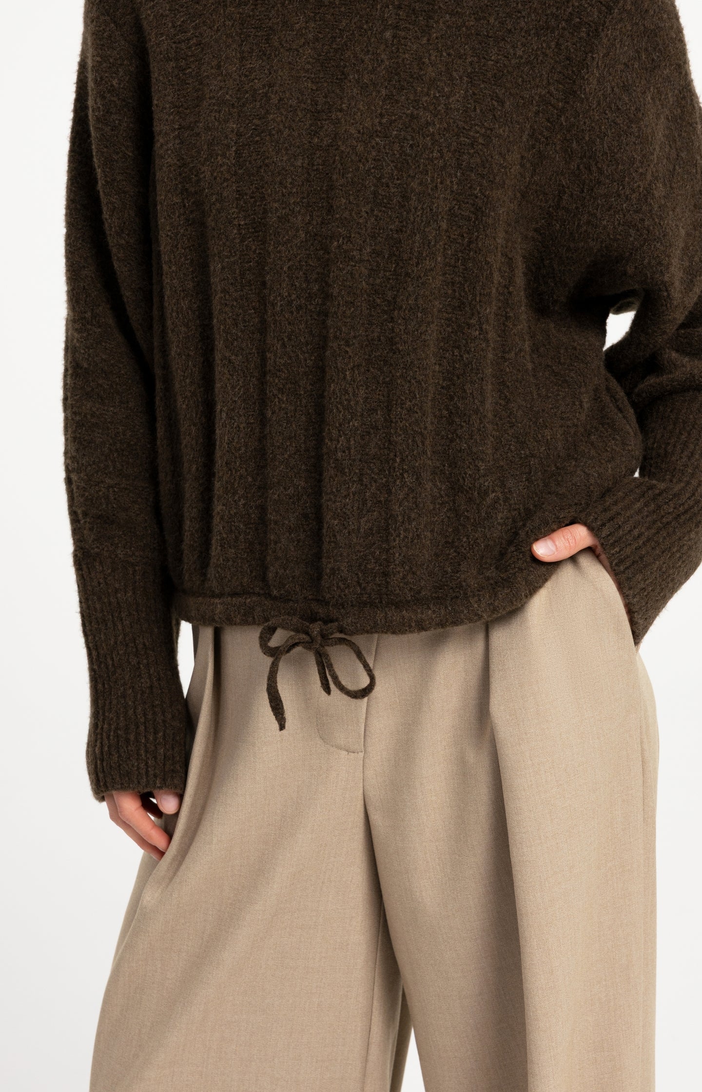 Sweater with batwing sleeves and drawcord at the hem