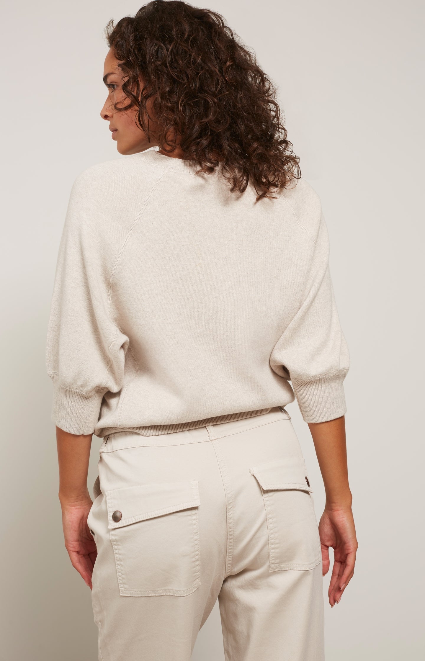 Sweater with round neck and mid-length raglan sleeves