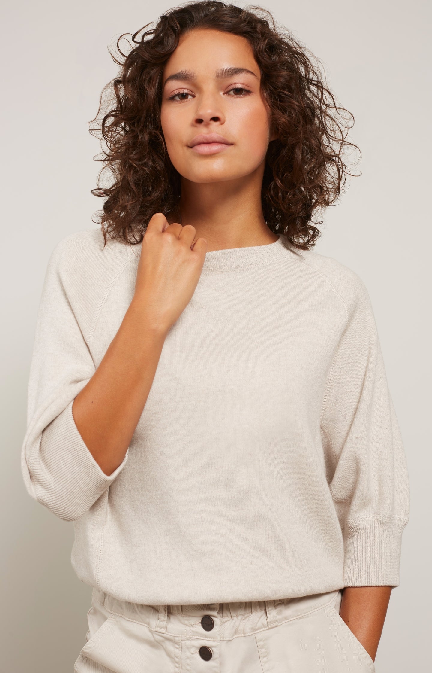 Sweater with round neck and mid-length raglan sleeves