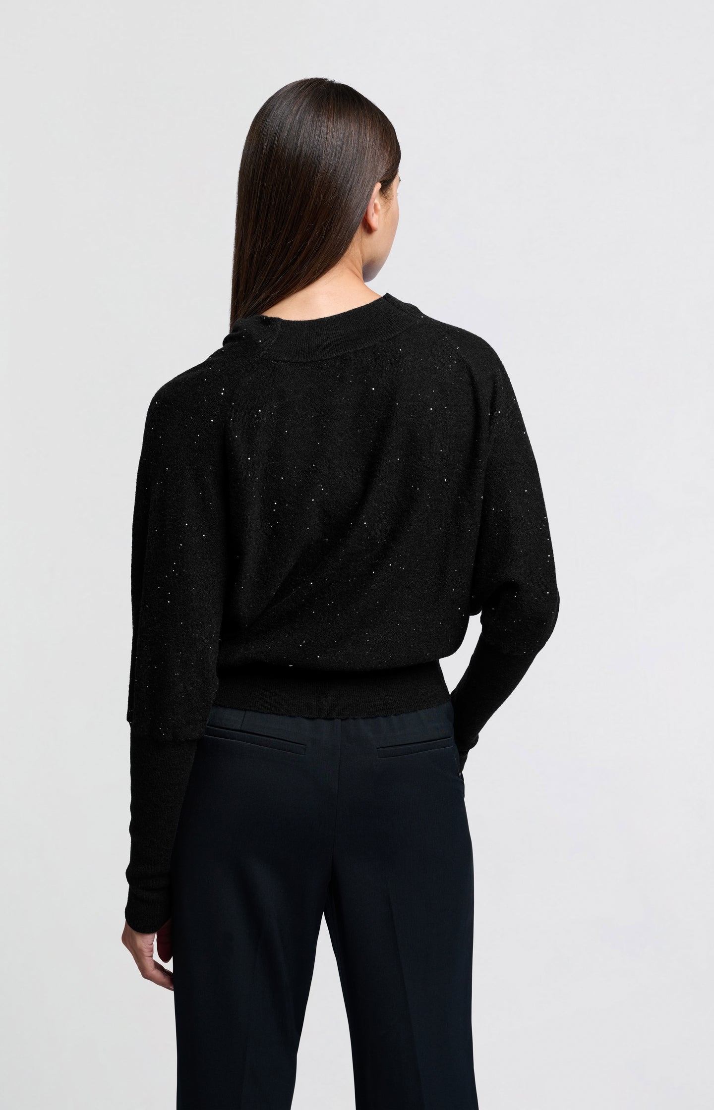 Sweater with turtleneck, batwing sleeves and glitter sequins