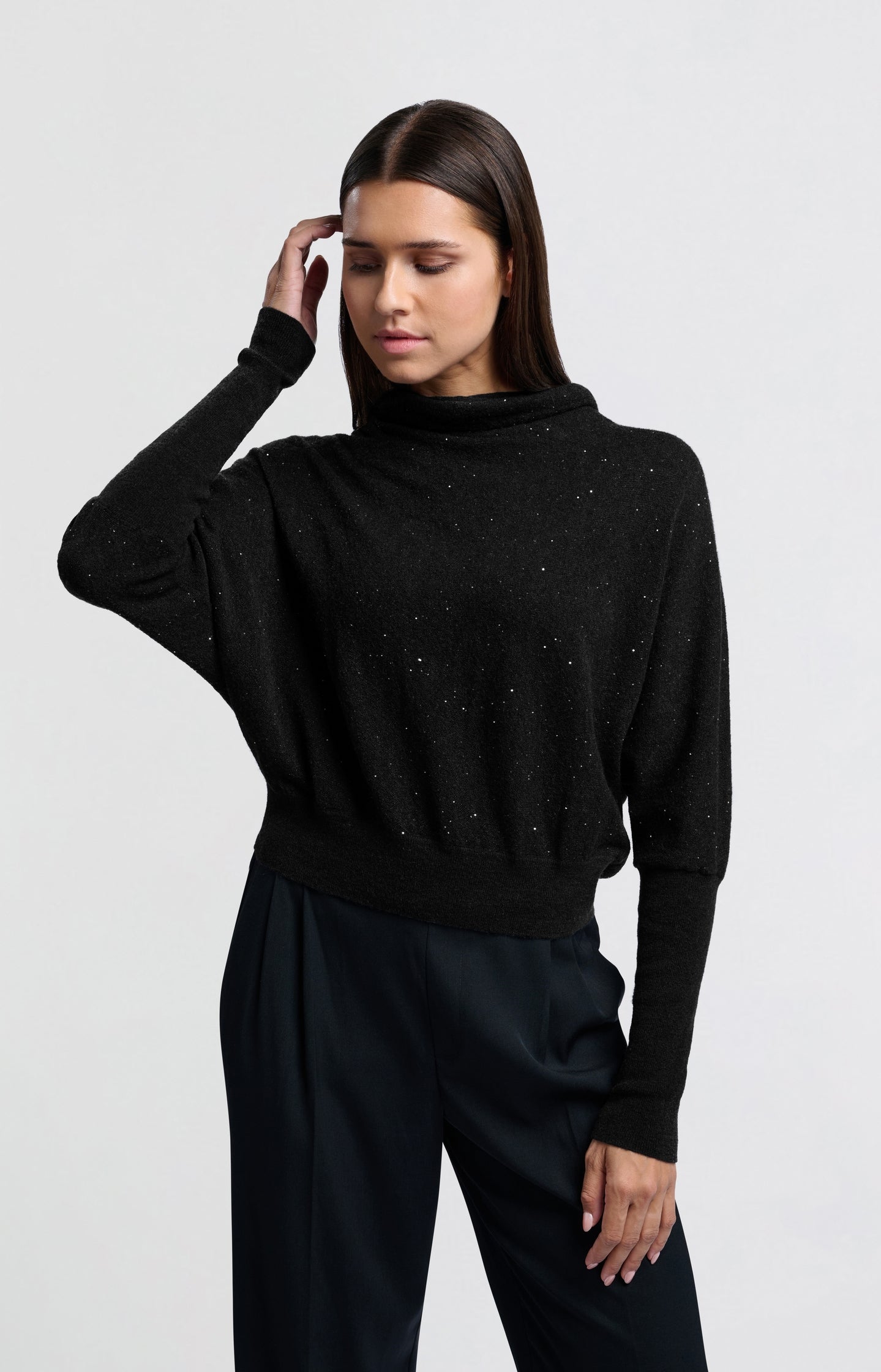 Sweater with turtleneck, batwing sleeves and glitter sequins