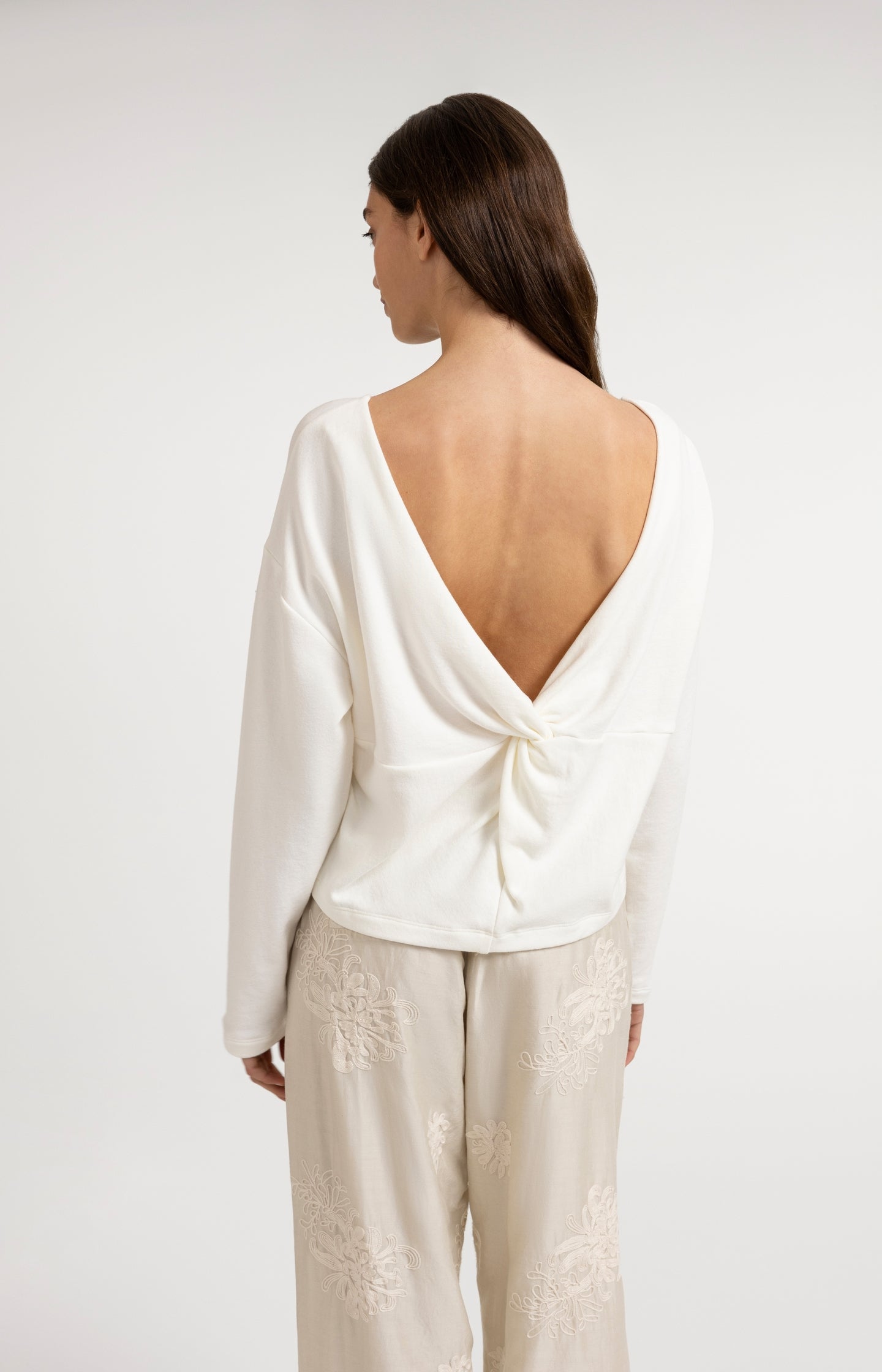 Sweater with V-neck and twisted detail at the back