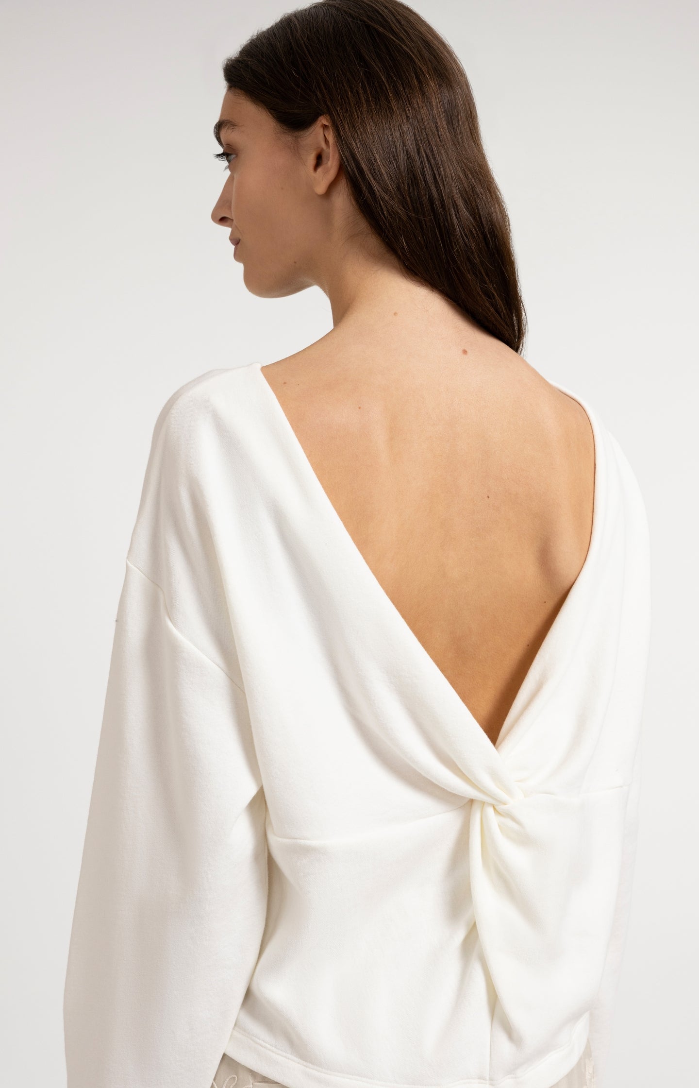 Sweater with V-neck and twisted detail at the back