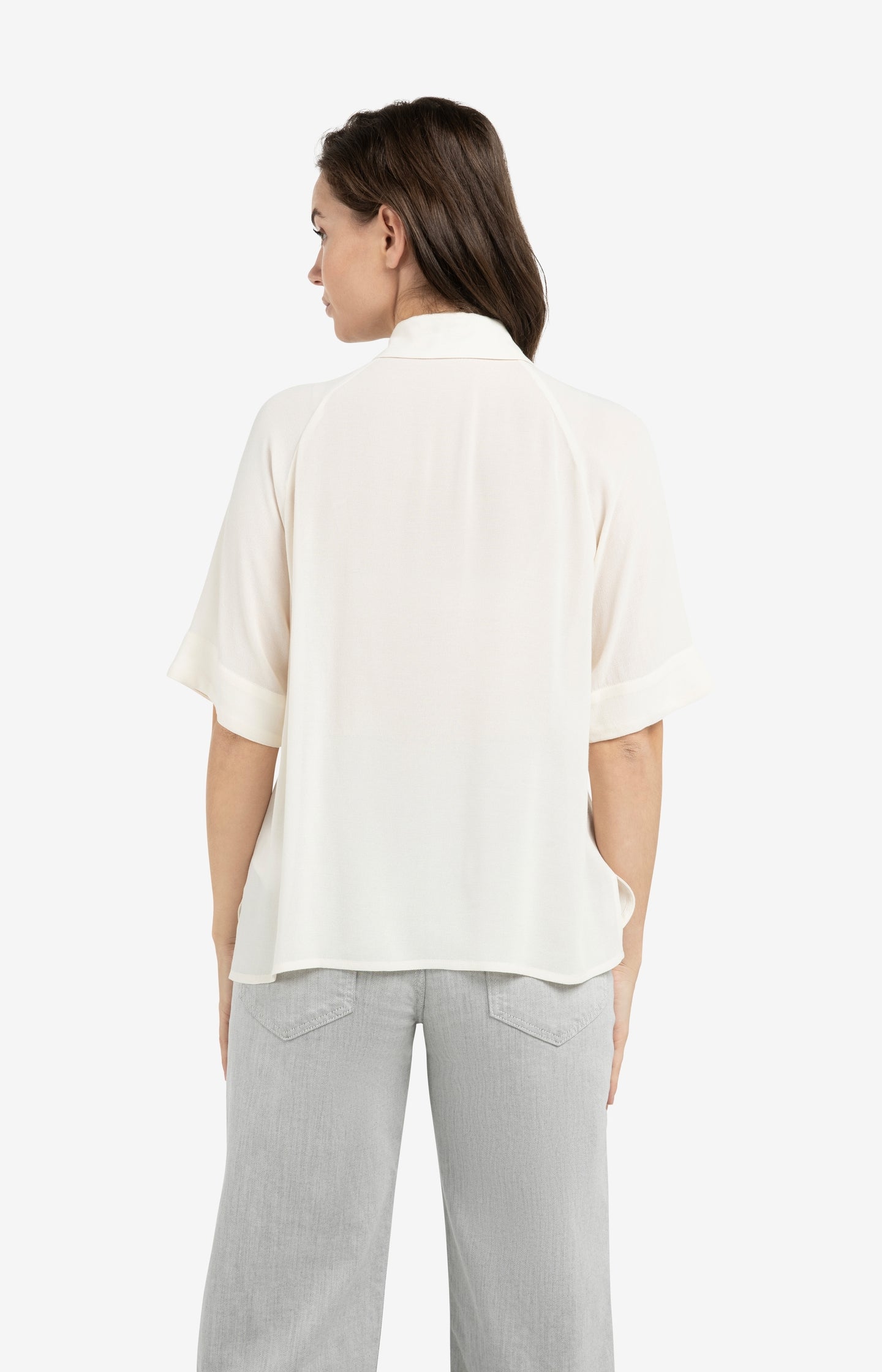 Top with short raglan sleeves and pearl detail