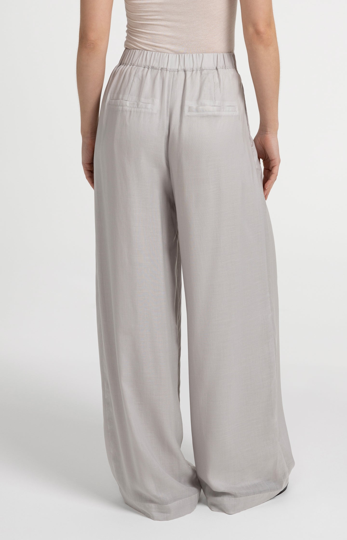 Trousers with wide legs and half elastic waist