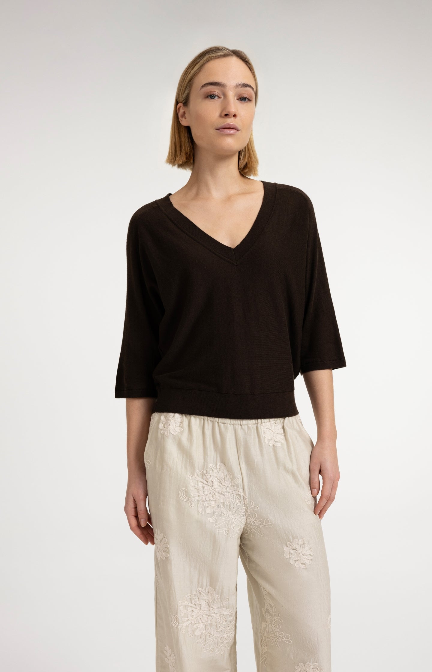 V-neck sweater with three-quarter sleeves and seam details