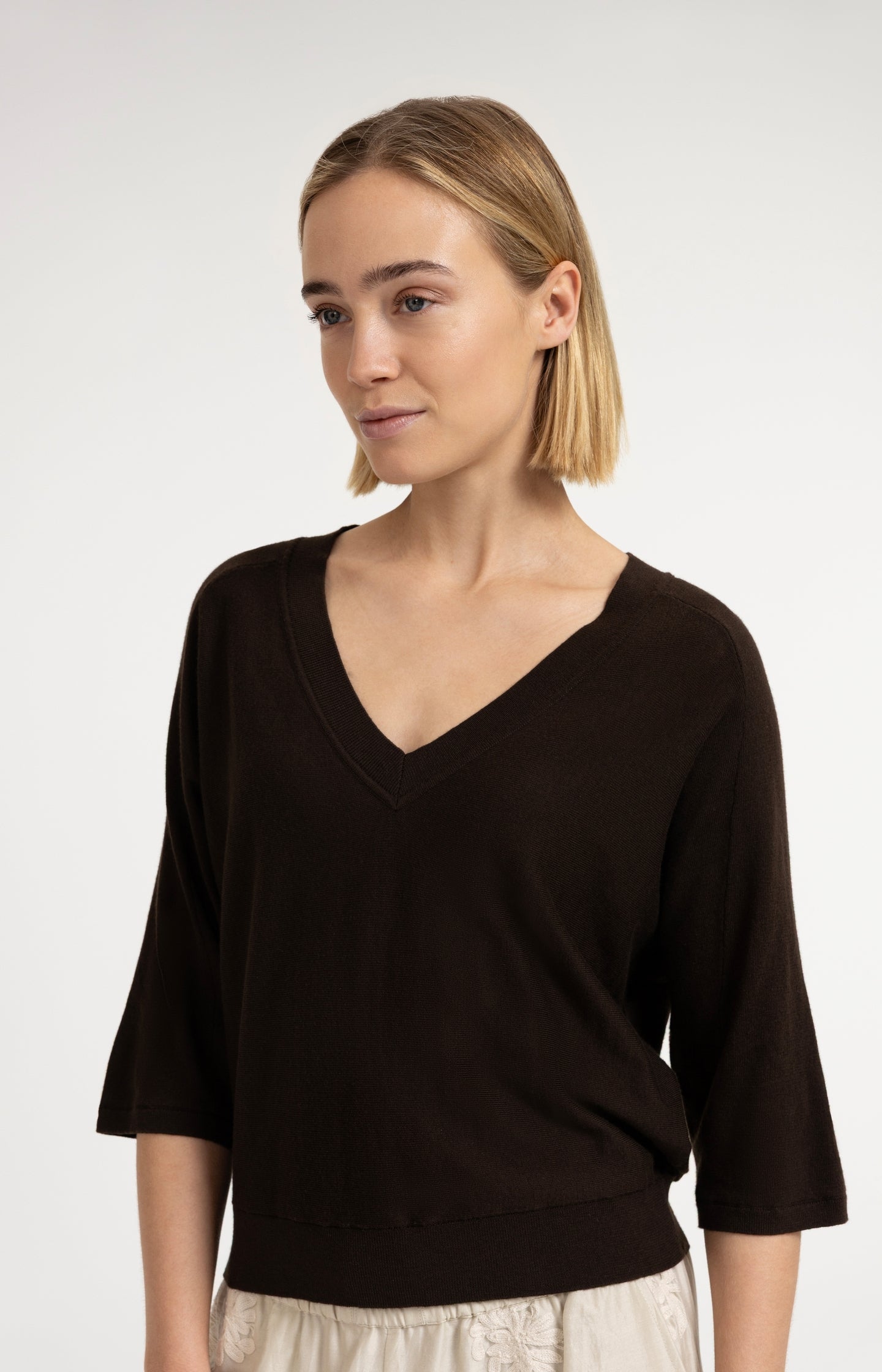 V-neck sweater with three-quarter sleeves and seam details