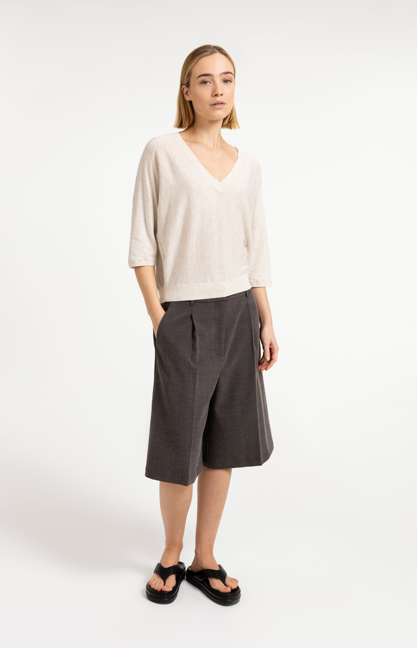 V-neck sweater with three-quarter sleeves and seam details
