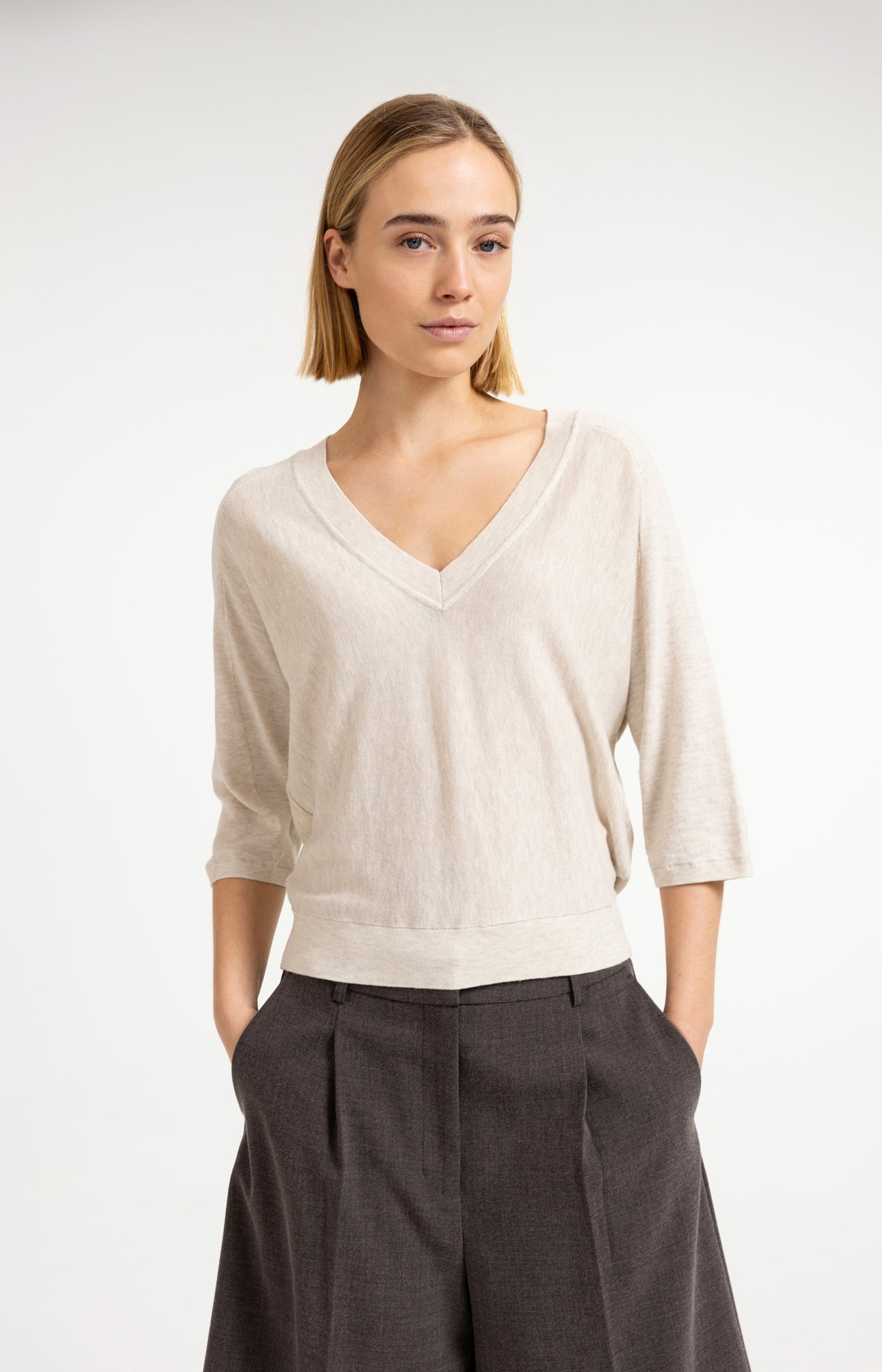 V-neck sweater with three-quarter sleeves and seam details
