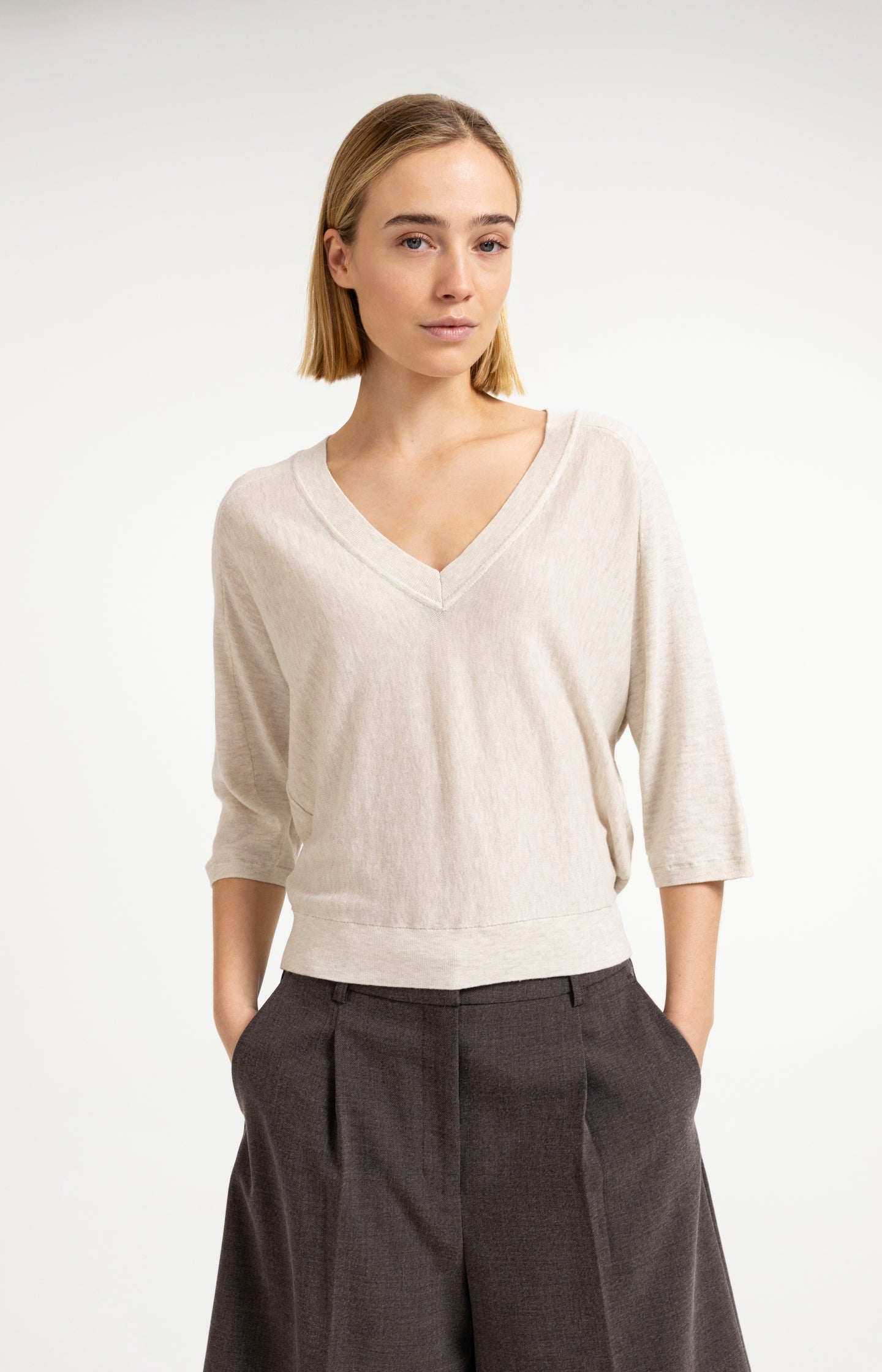 V-neck sweater with three-quarter sleeves and seam details