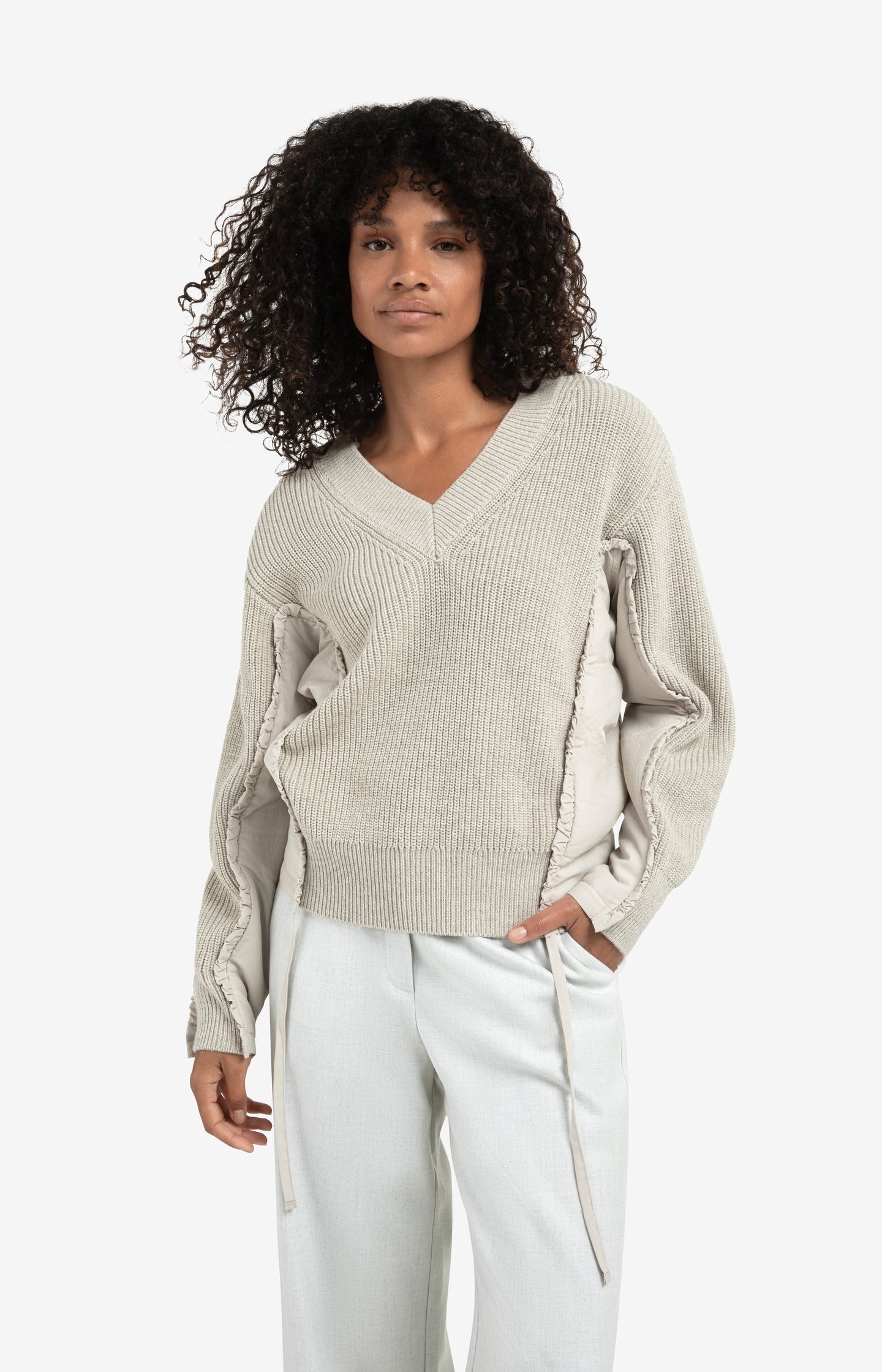 V-neck sweater with woven insert details and tie accents