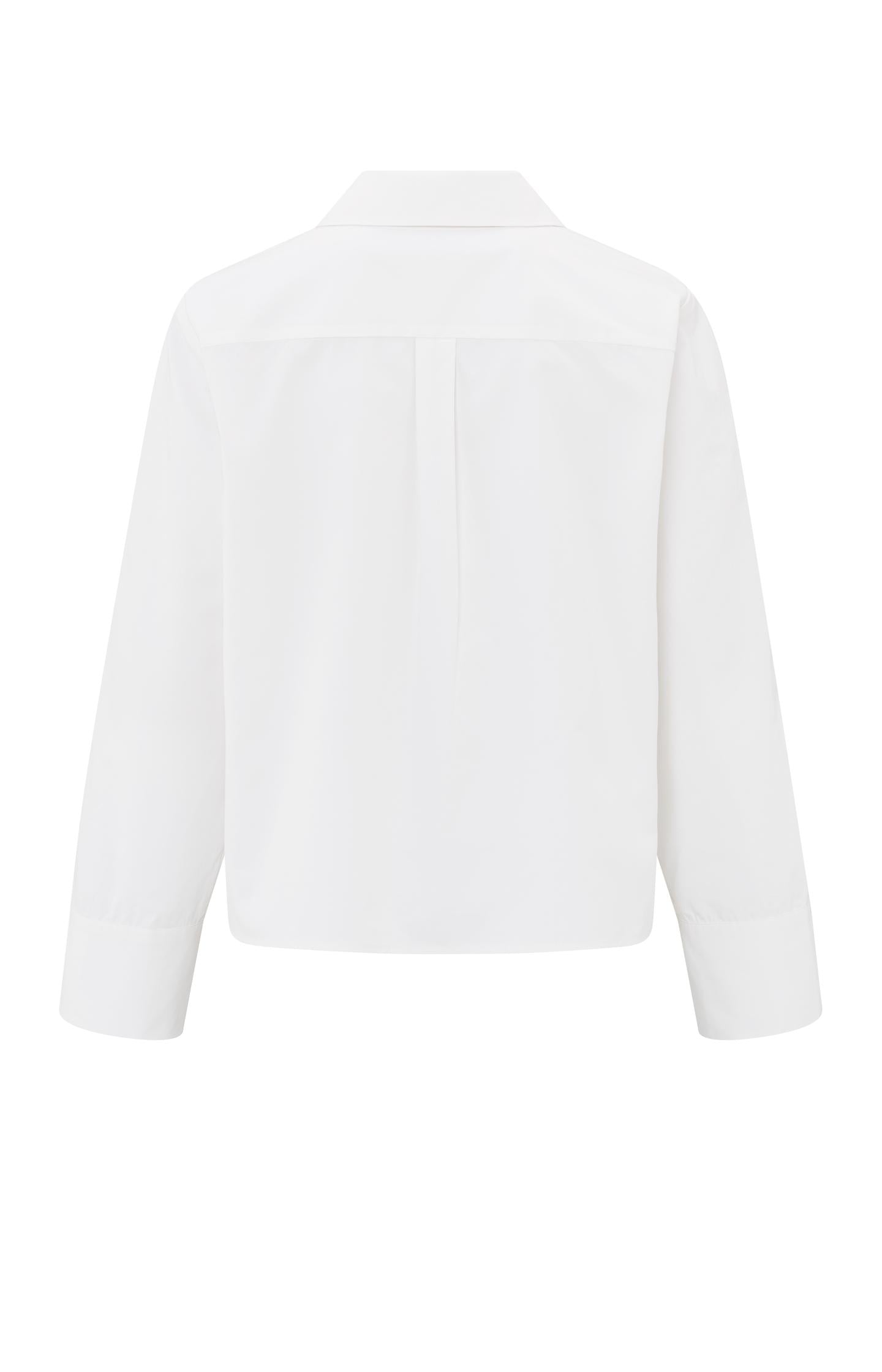 White blouse with long sleeves and button details