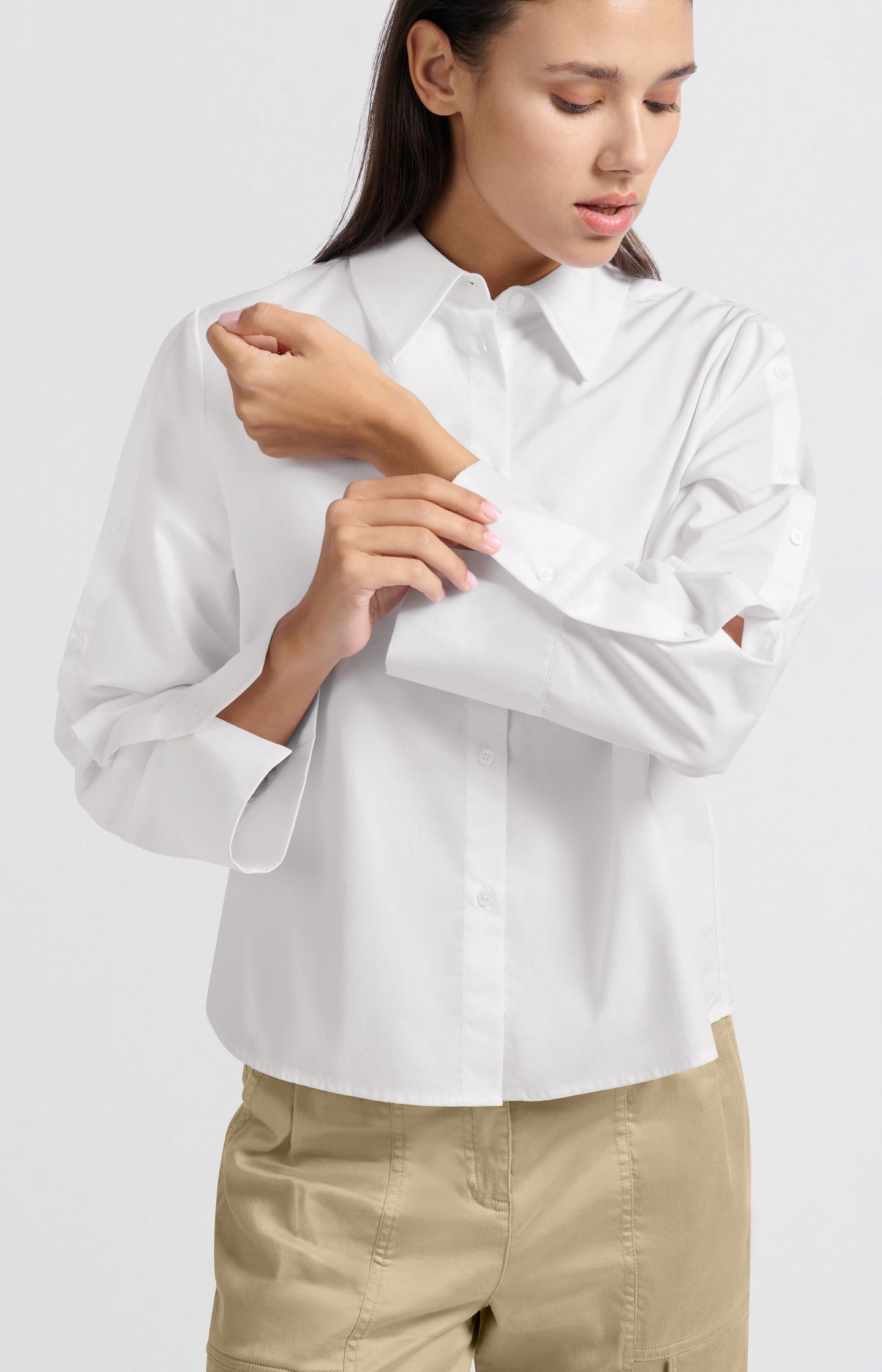 White blouse with long sleeves and button details