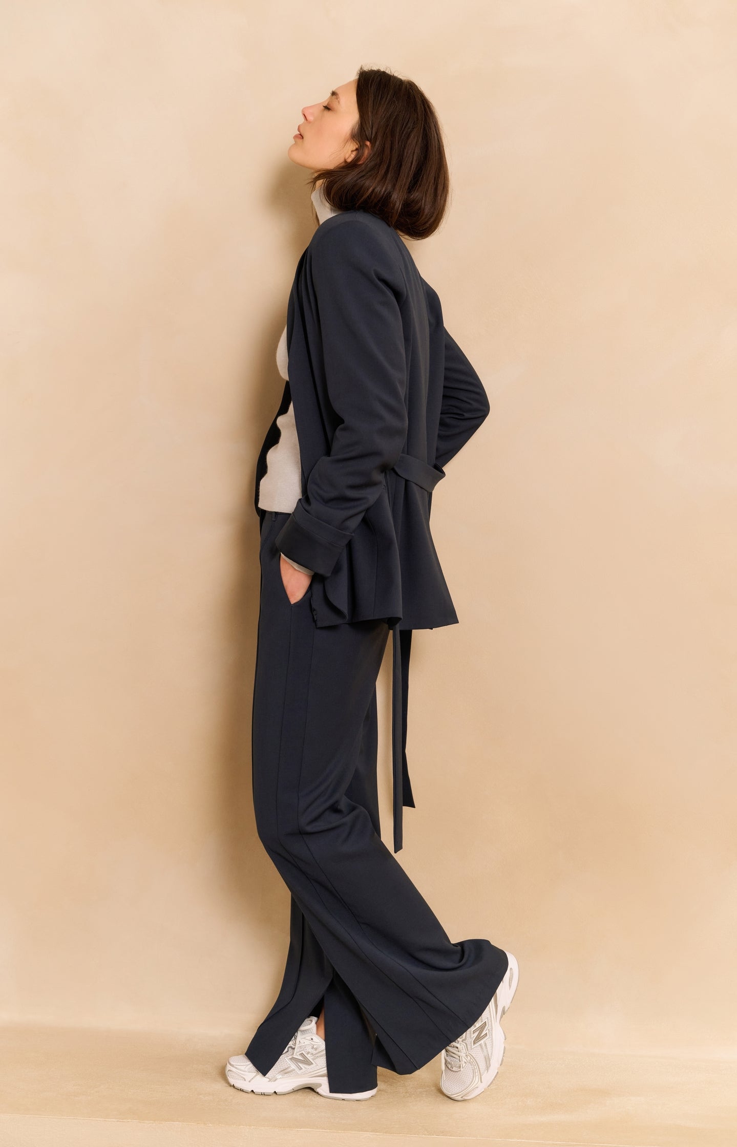 Wide leg trousers with decorative seams and slit