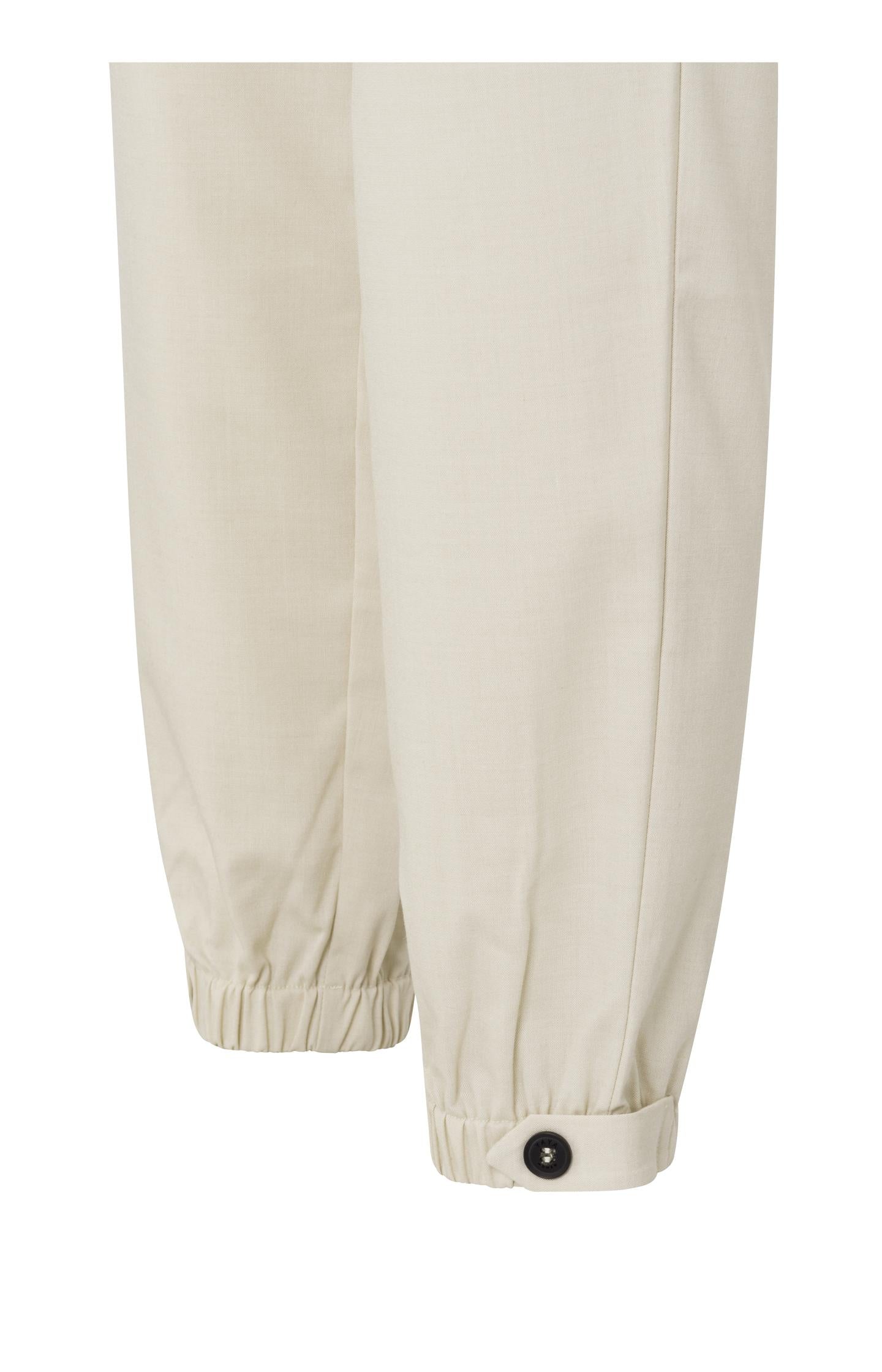 Woven trousers with elastic waist, side pockets and buttons