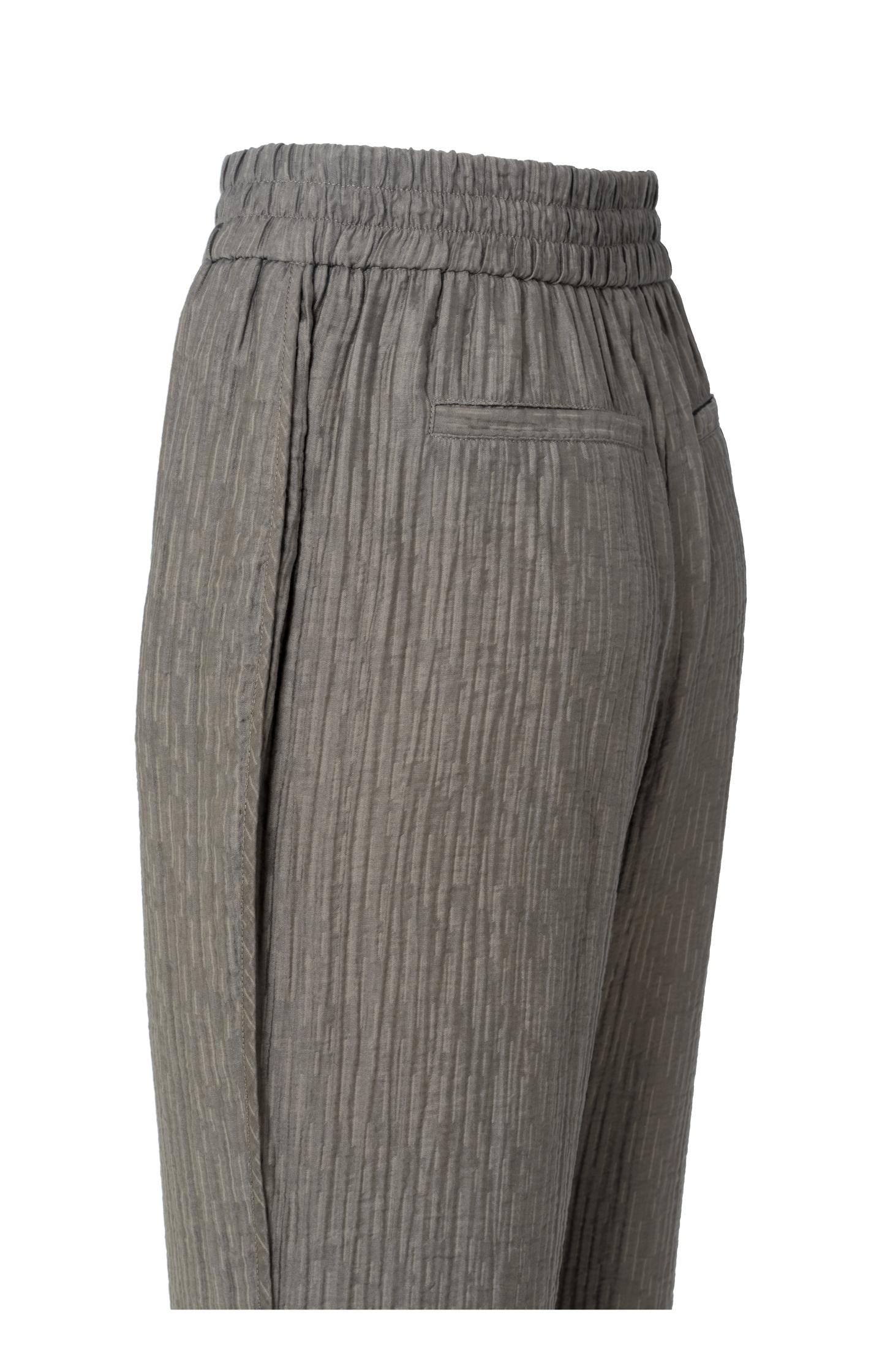 Woven trousers with side pockets and elastic waist