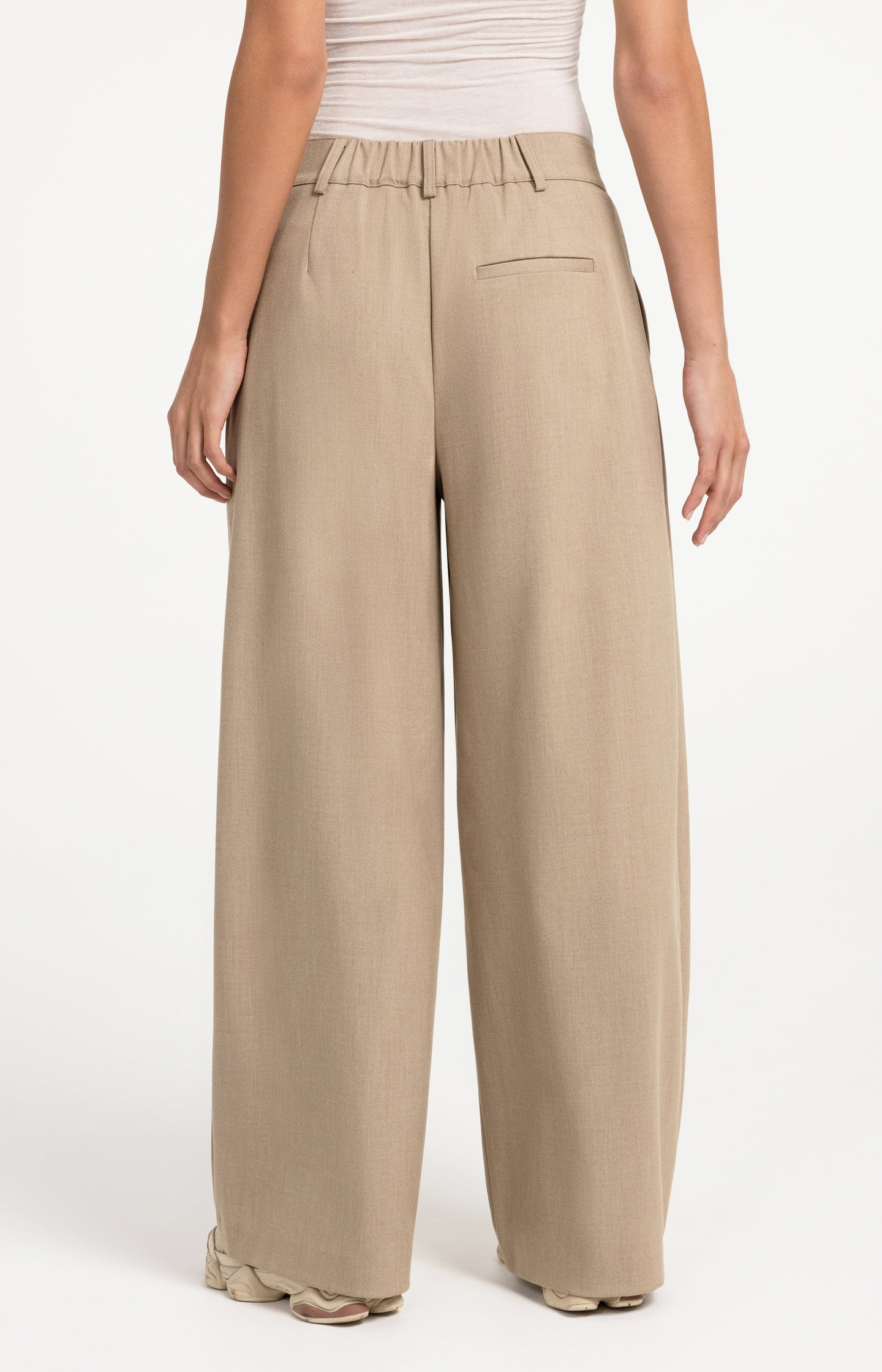 Woven trousers with wide legs and asymmetrical closure