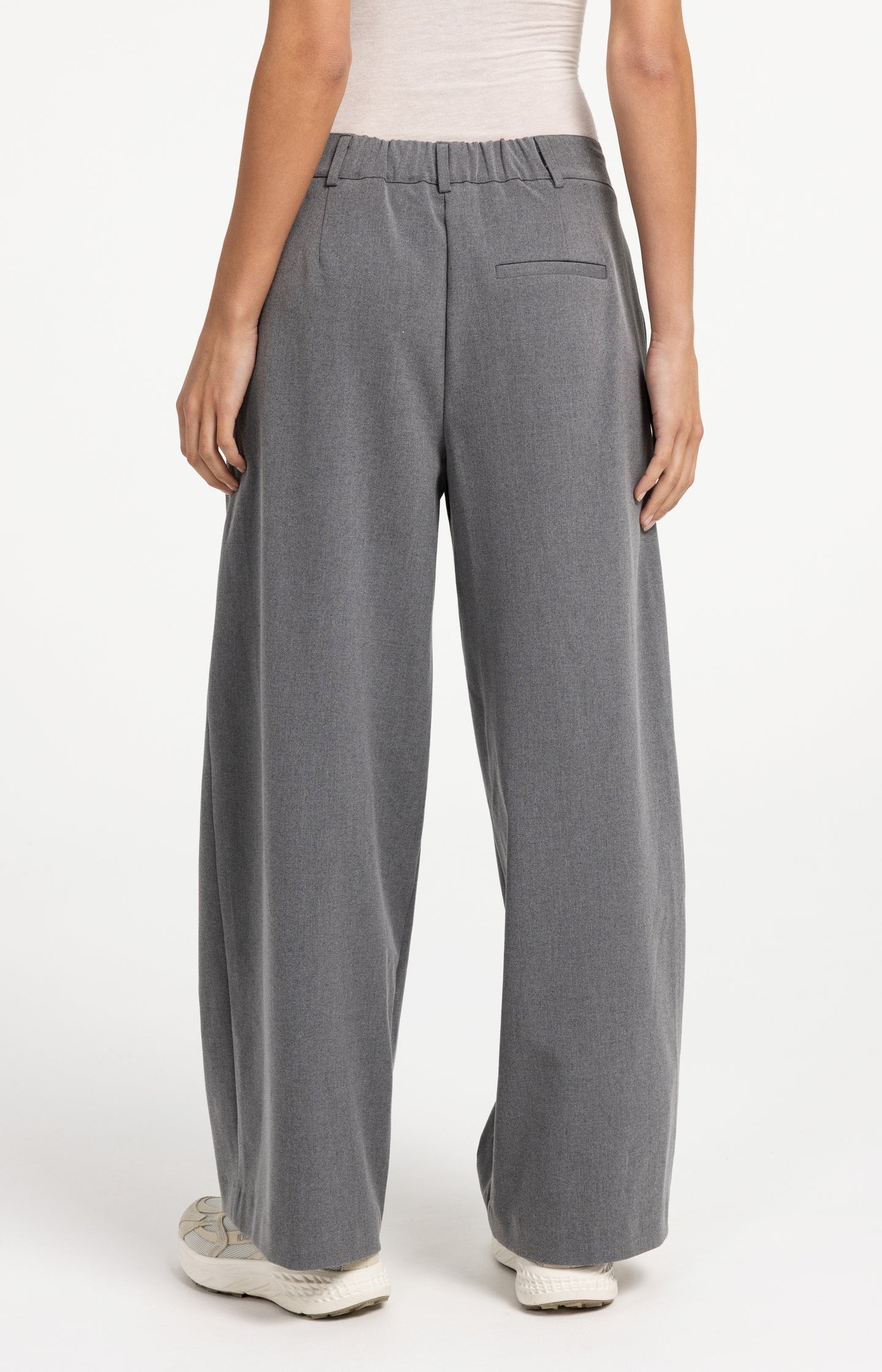 Woven trousers with wide legs and asymmetrical closure