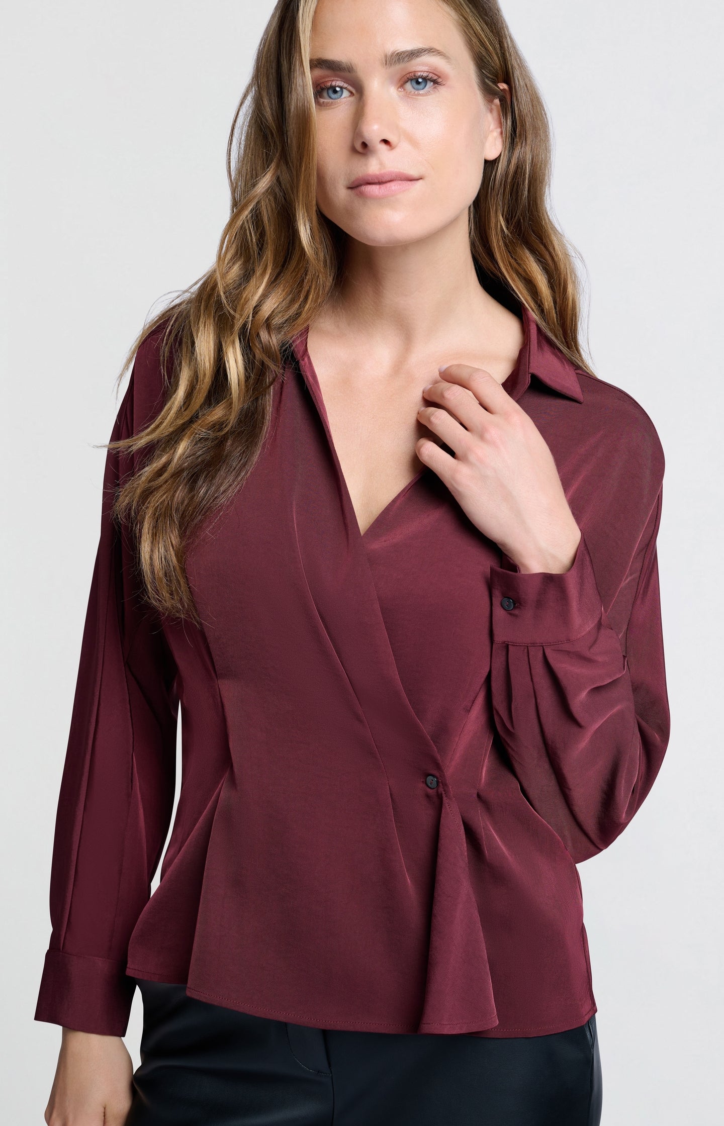 Wrap blouse with long sleeves and subtle button