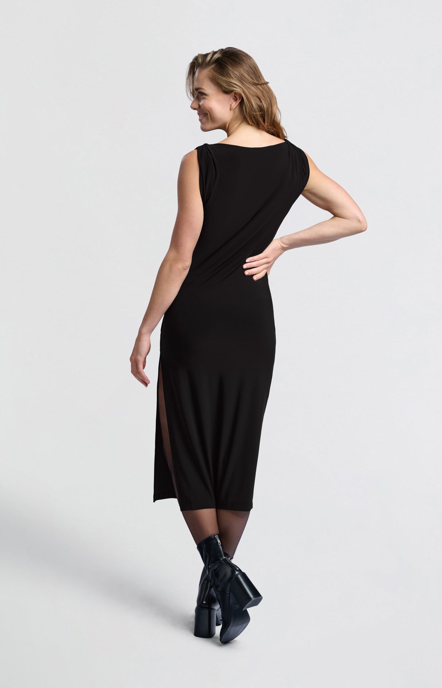 Black dress with twisted shoulder detail and side slit