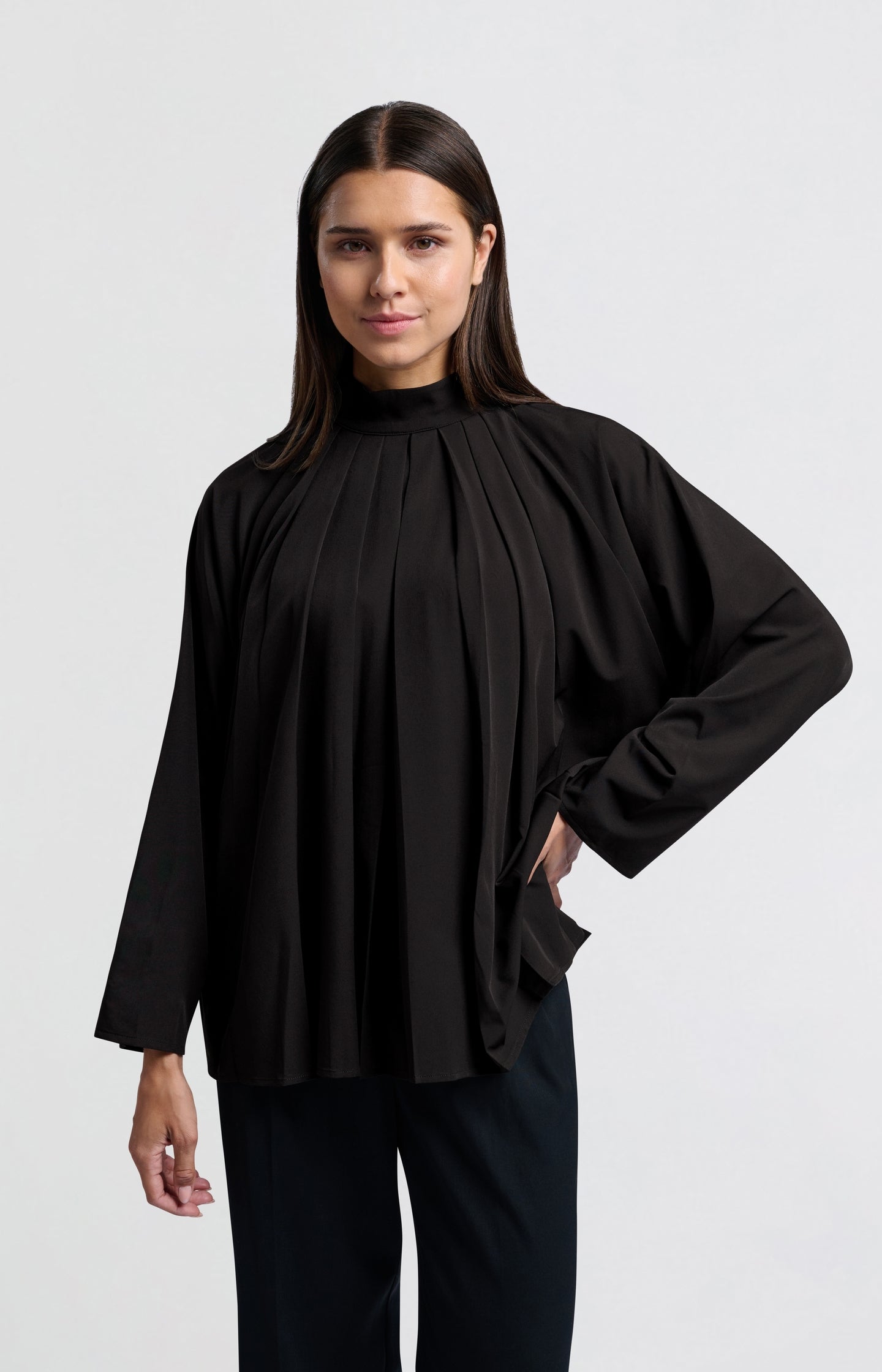 Black top with pleated details and turtleneck